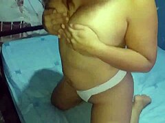Homemade video of a Latina prostitute dancing and exposing her big tits
